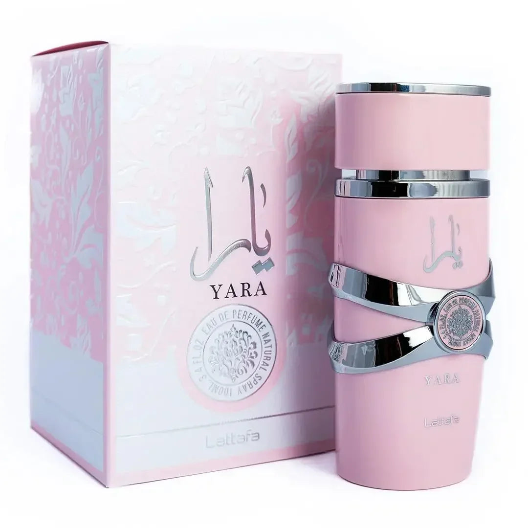Pink Yara perfume bottle with packaging on a white background