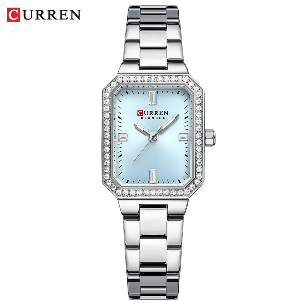 Silver Curren watch with a light blue face on a white background