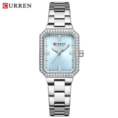 Silver Curren watch with a light blue face on a white background