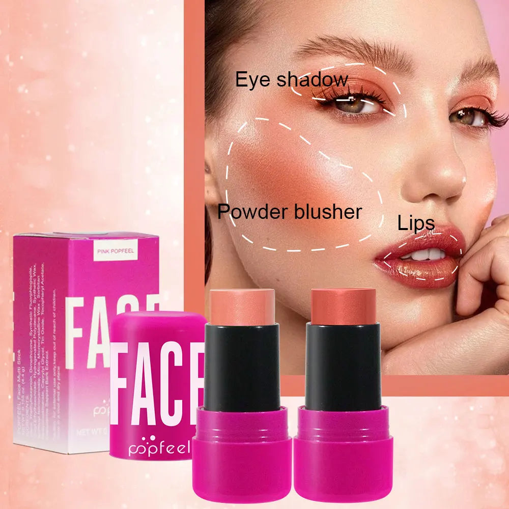 Two pink makeup sticks with black caps and a pink box labeled 'FA' on a pink background.