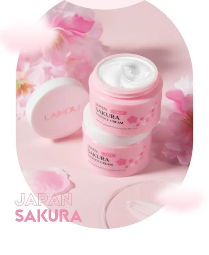 Pink skincare product with cherry blossoms and 'Japan Sakura' text on a pink background