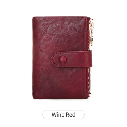 Wine red wallet with a gold zipper on a white background